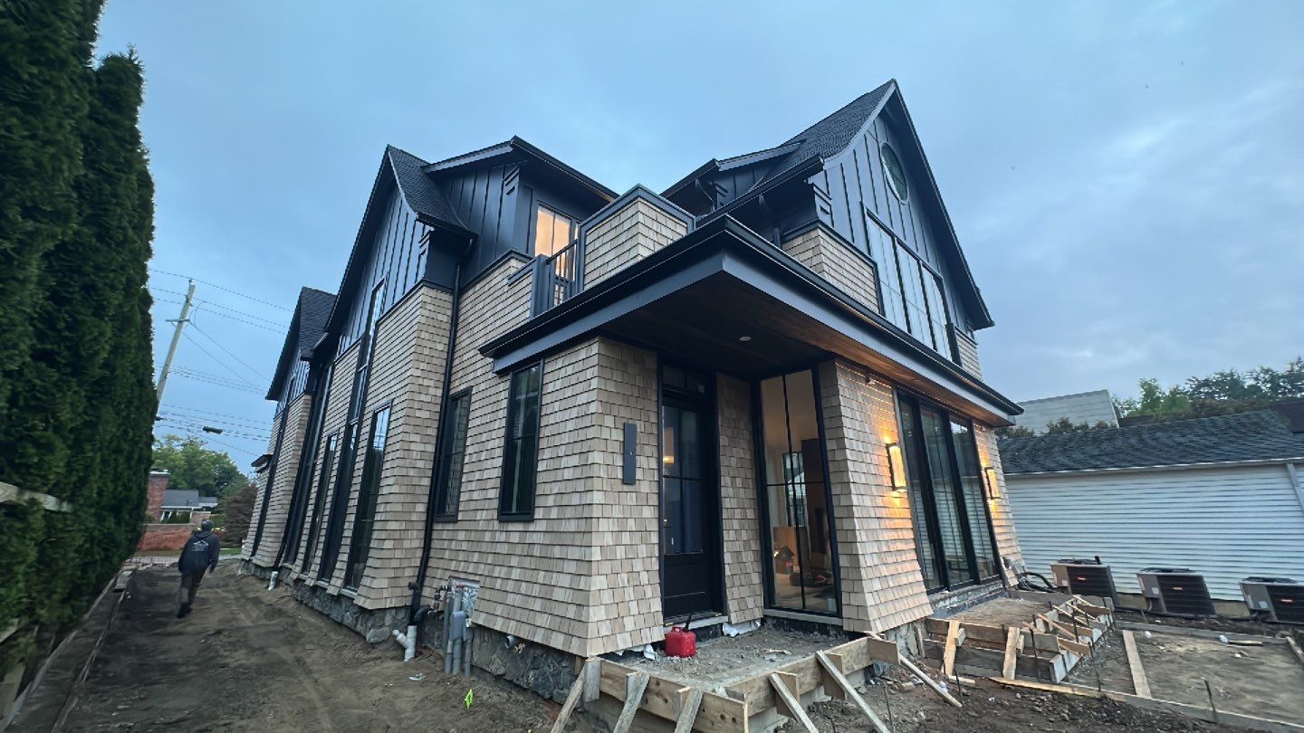 Cedar shake and black metal custom luxury siding build