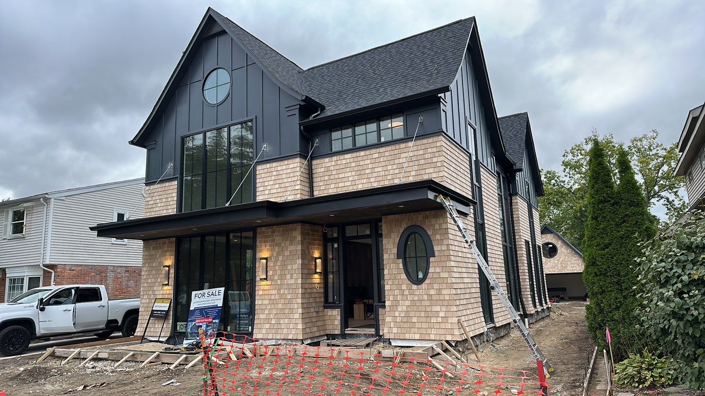 Modern farmhouse with cedar shake luxury siding